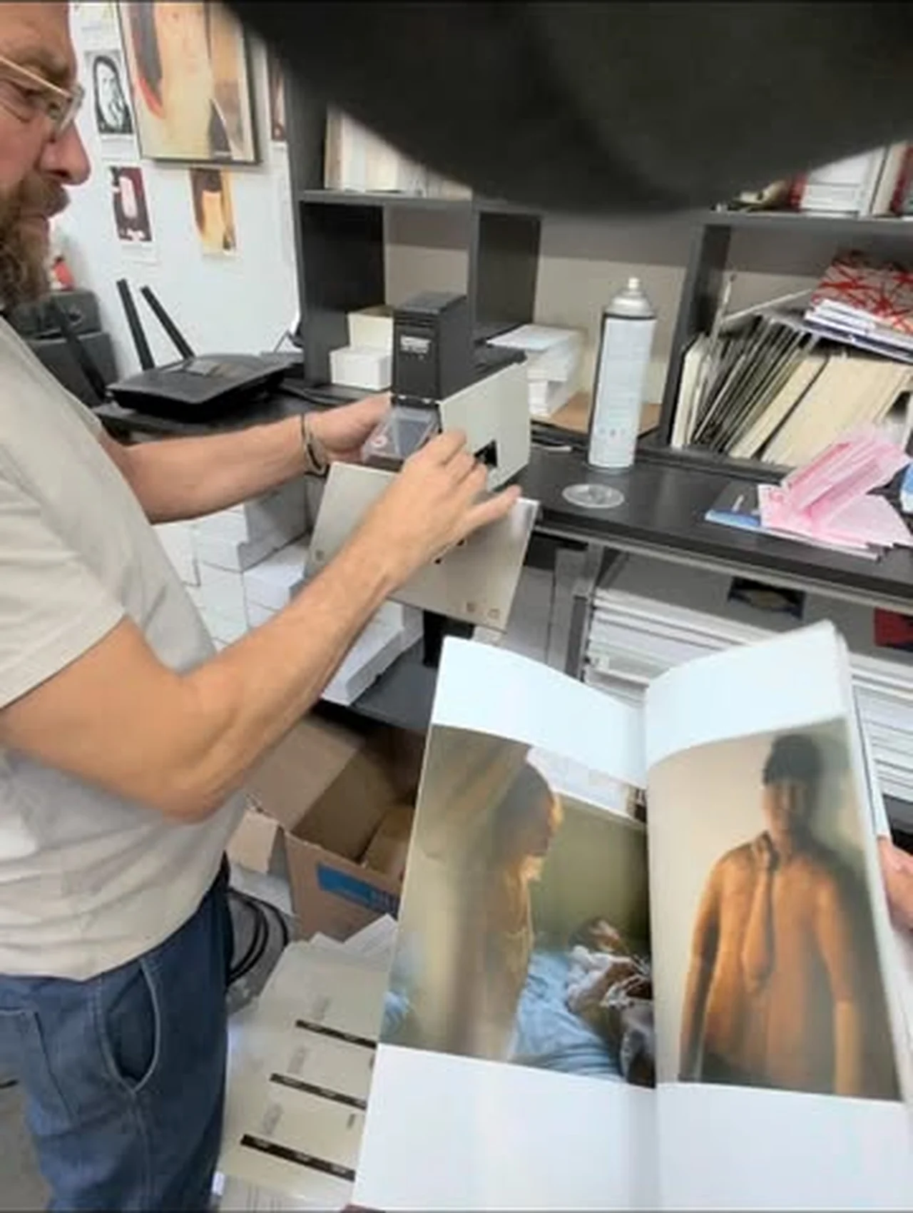 Art book spread being checked in the studio