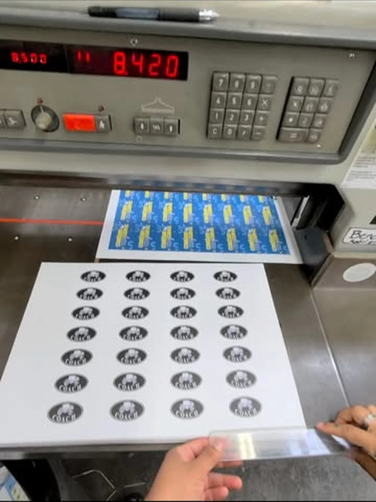 Sticker sheets on the guillotine cutter