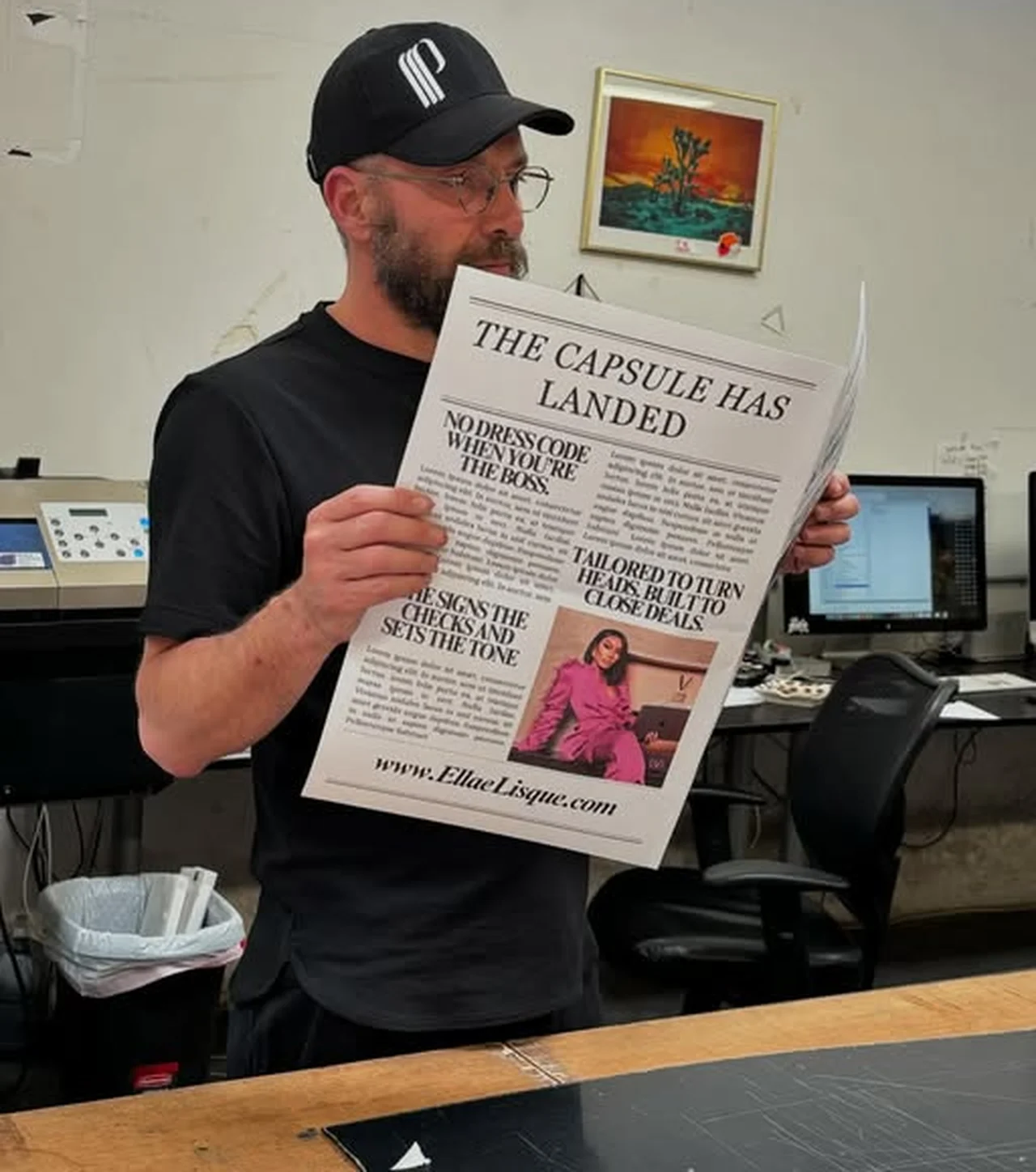Printed brand newspaper held open in the studio